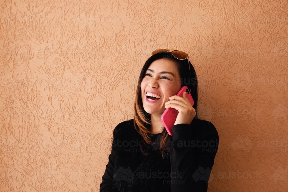 Southeast Asian multicultural woman on the phone - Australian Stock Image