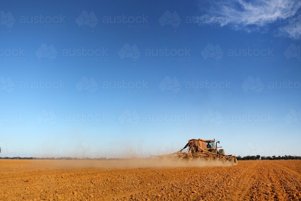 Sowing a crop in early morning light - Australian Stock Image