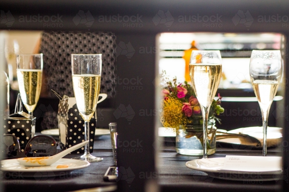 Sparkling Wine Glasses on restaurant table - Australian Stock Image