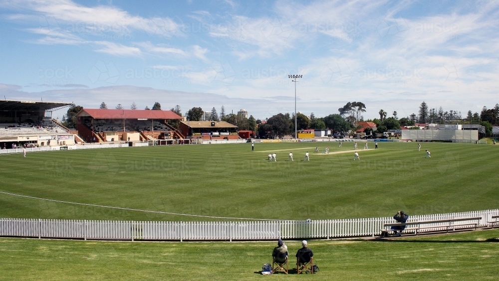 Spectators watching a cricket game - Australian Stock Image