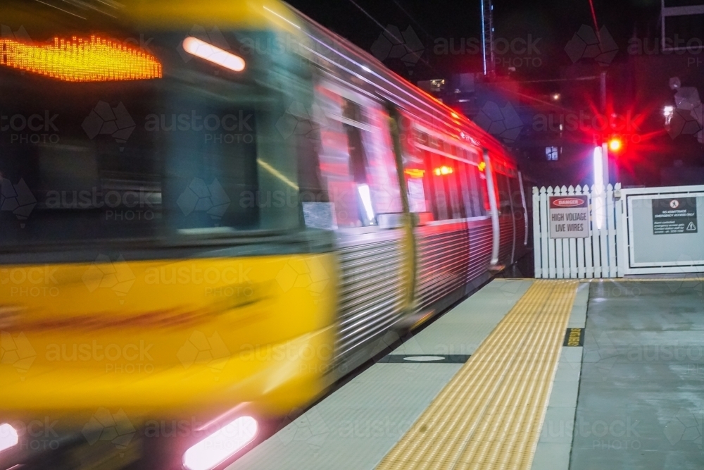 Speeding train pulling into station - Australian Stock Image