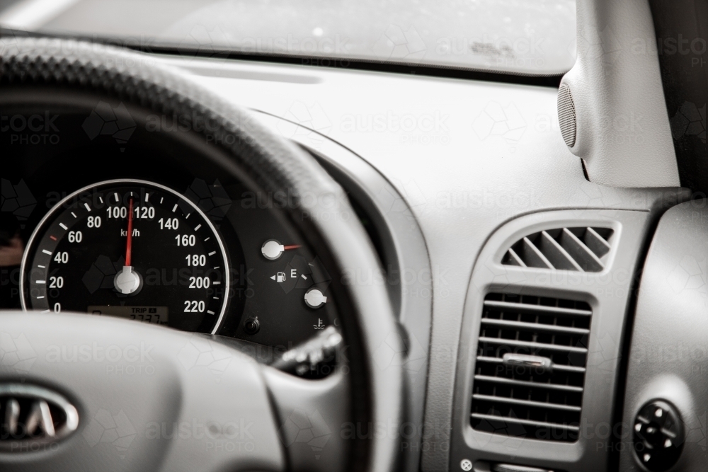 Image of Speedo and dashboard of car on the road Austockphoto