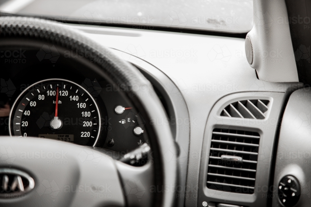 Speedo and dashboard of car on the road - Australian Stock Image
