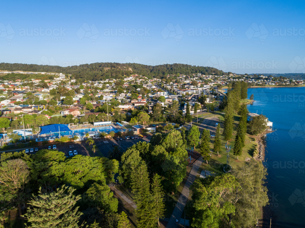 speers point swim centre pool aerial view in late afternoon with residential streets behind - Australian Stock Image