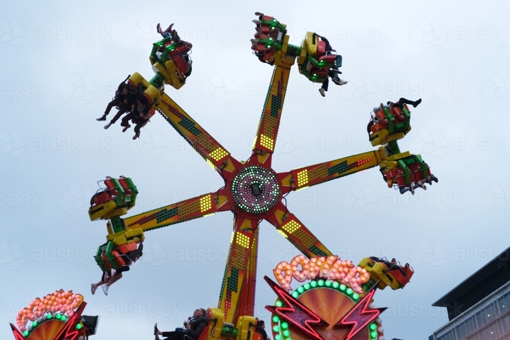 Image of Spinning ride in motion at the carnival - Austockphoto