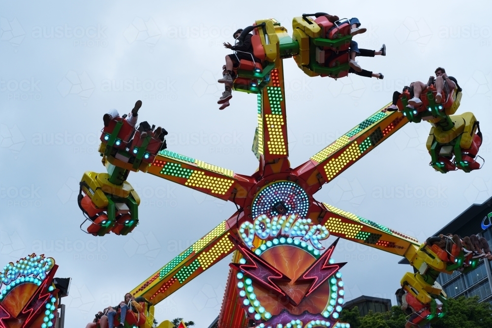 Circular Moving Rides Image of Spinning ride in motion at the carnival - Austockphoto