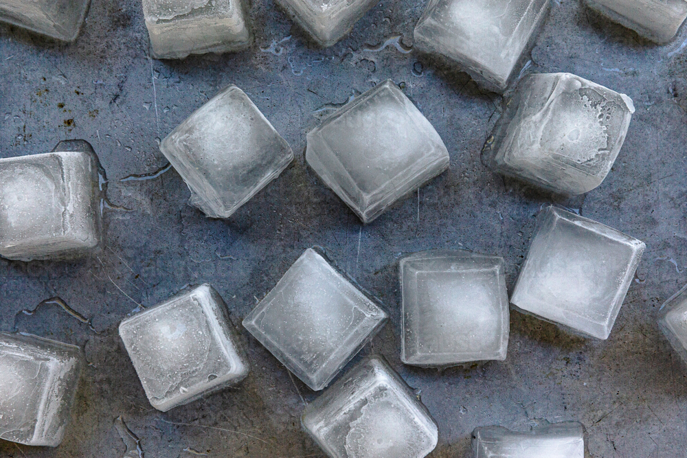 Square icecubes on a silver background - Australian Stock Image