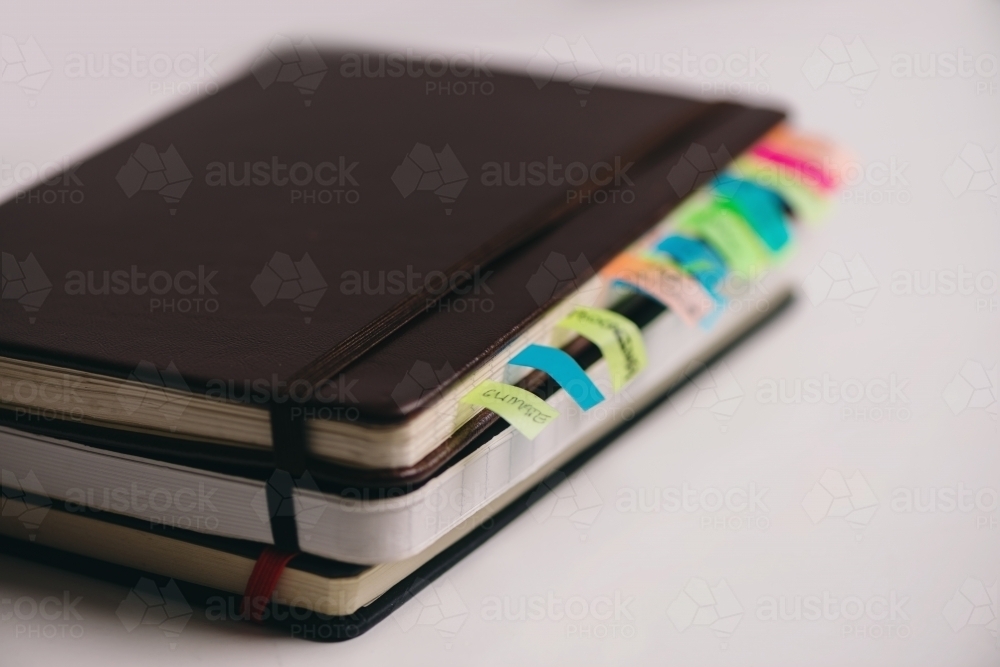 stack of notebooks - Australian Stock Image