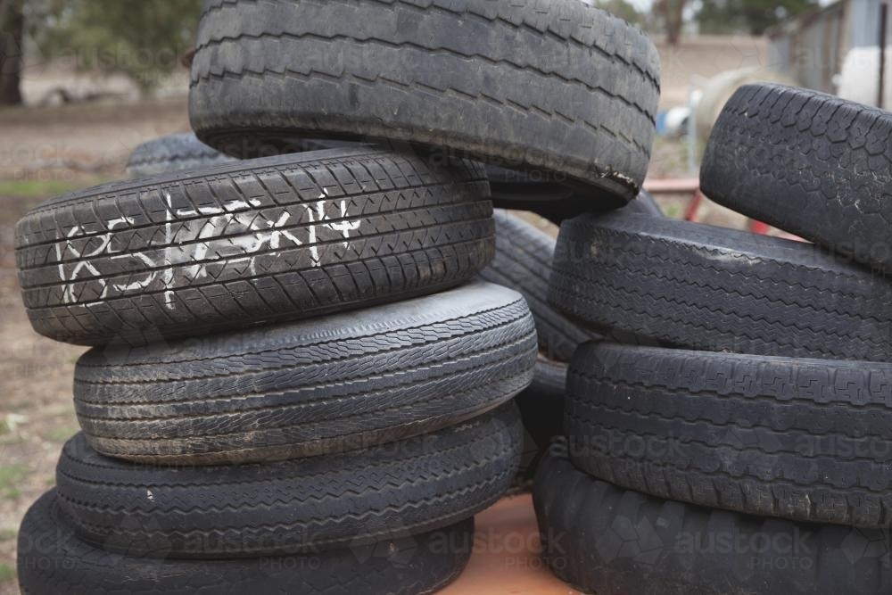Stack of old tyres for recycling / re-use - Australian Stock Image