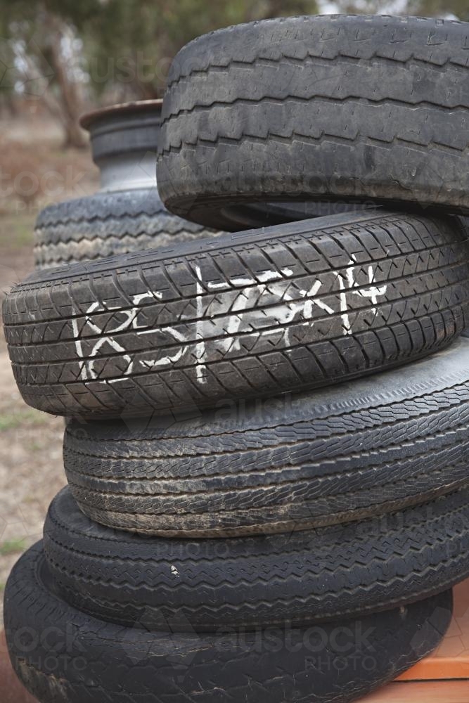 stack of old tyres for recycling / re-use - Australian Stock Image