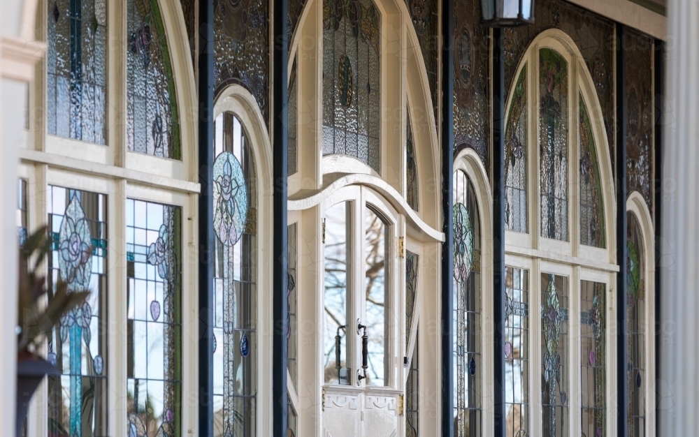 Stained glass facade with reflected natural light from exterior perspective - Australian Stock Image