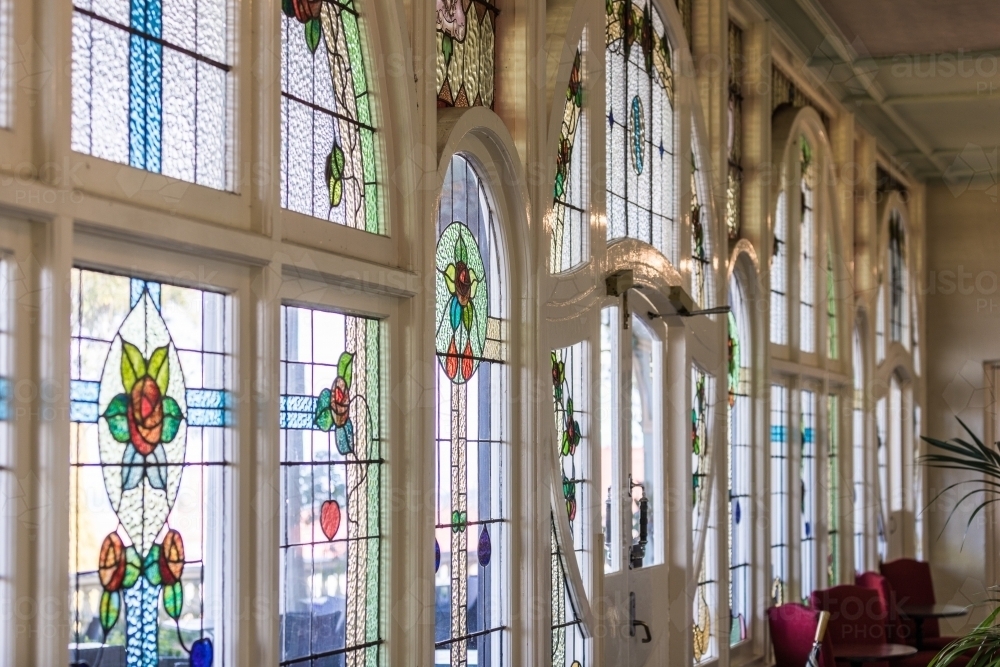 Stained glass wall with diffused natural light from interior perspective - Australian Stock Image