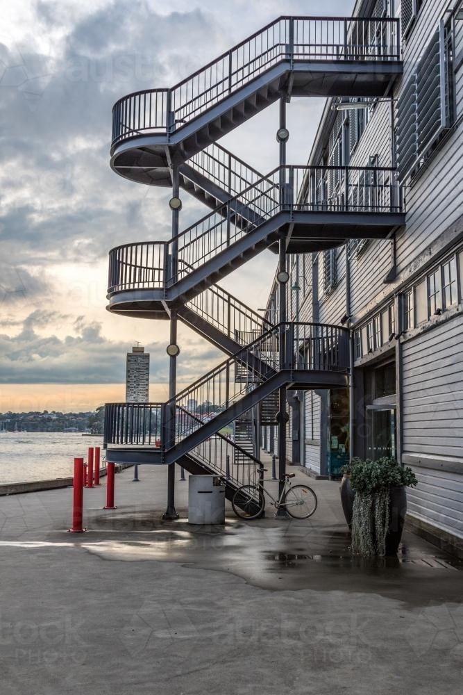 Stair leading up the side of a building beside Sydney Harbour - Australian Stock Image