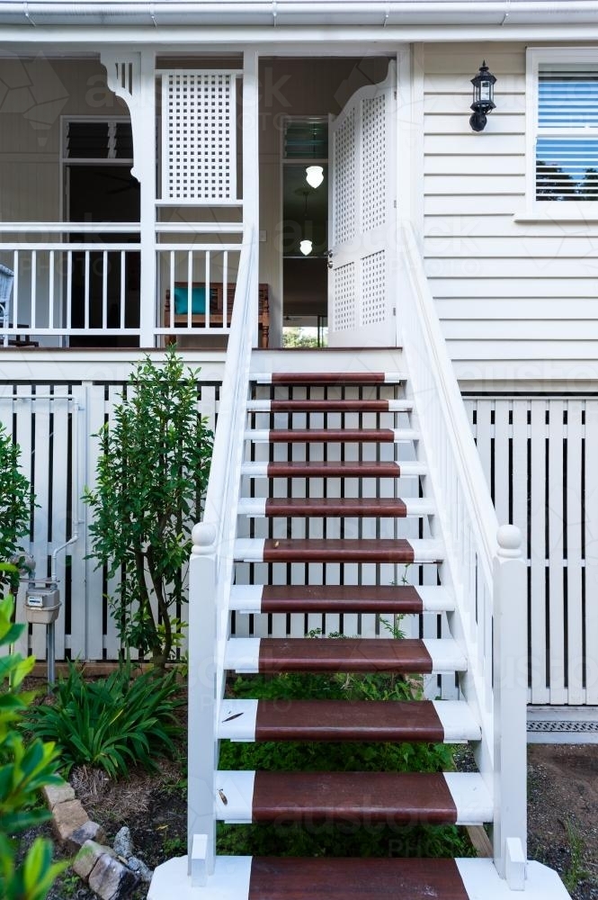 stairs on the front veranda of a Queenslander home - Australian Stock Image