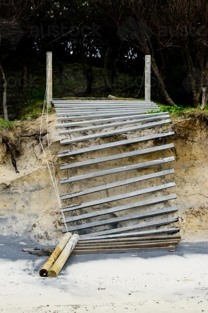 Stairs to beach collapsing due to erosion - Australian Stock Image