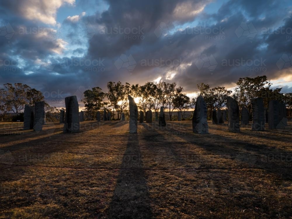 Standing Stones backlit by sunrise - Australian Stock Image
