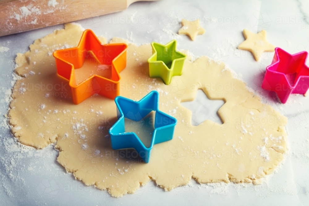 Star shaped cookie dough and rolling pin - Australian Stock Image