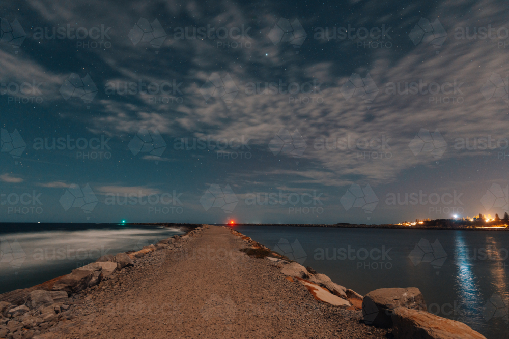 Starry night over the Iluka breakwall, long exposure astrophotography - Australian Stock Image