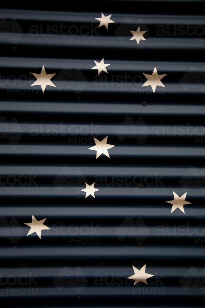Stars painted on corrugated iron - Australian Stock Image