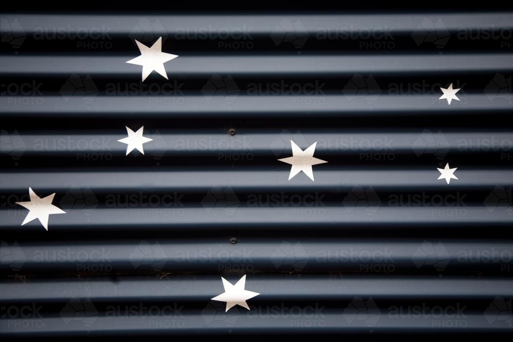 Stars painted on corrugated iron - Australian Stock Image