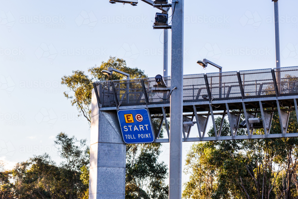 Start toll point sign with e-tag signage at entrance of road - Australian Stock Image