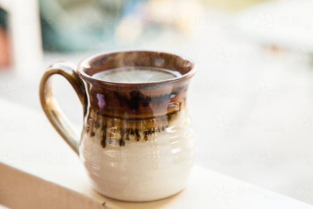 Steaming mug on a cold morning - Australian Stock Image