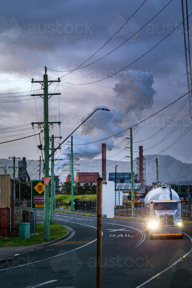Steel Smelter behind power lines and poles - Australian Stock Image