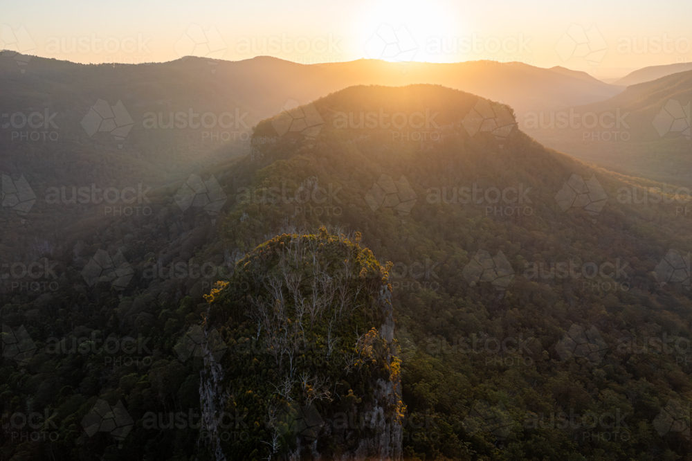 Steep rocky mountain landscape at sunset - Australian Stock Image