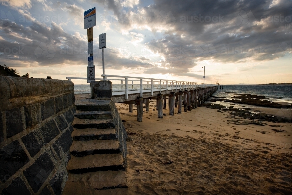 Steps and long jetty in late afternoon light - Australian Stock Image
