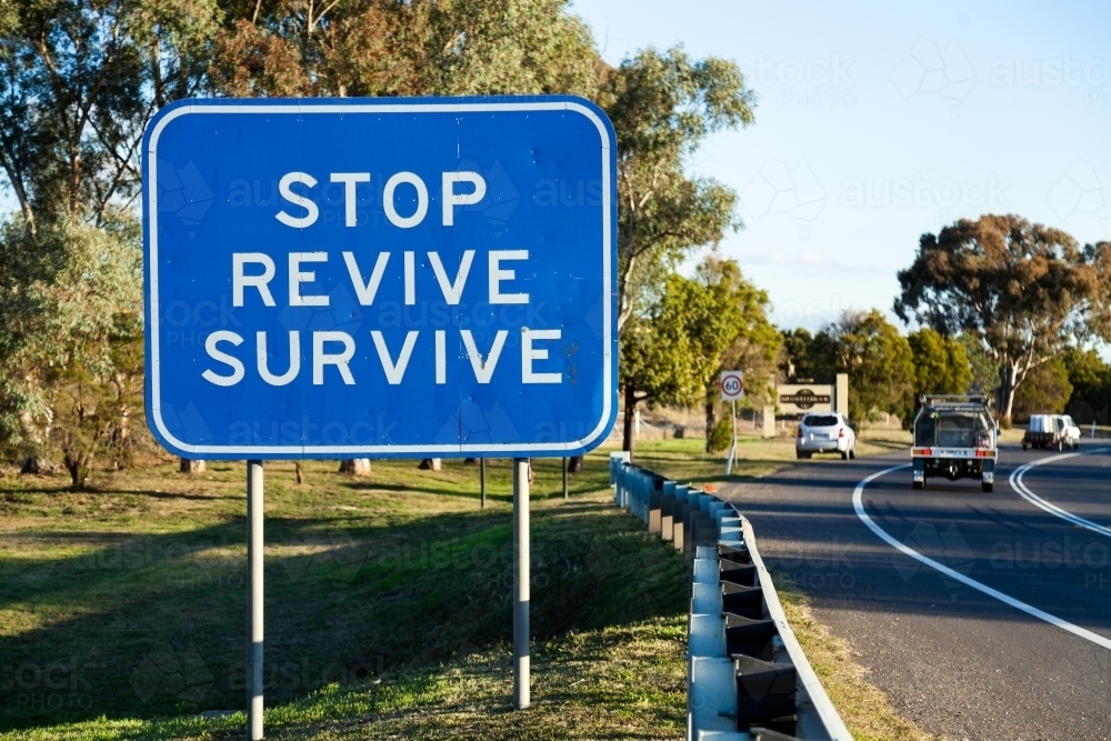 Stop revive survive sign beside highway - Australian Stock Image