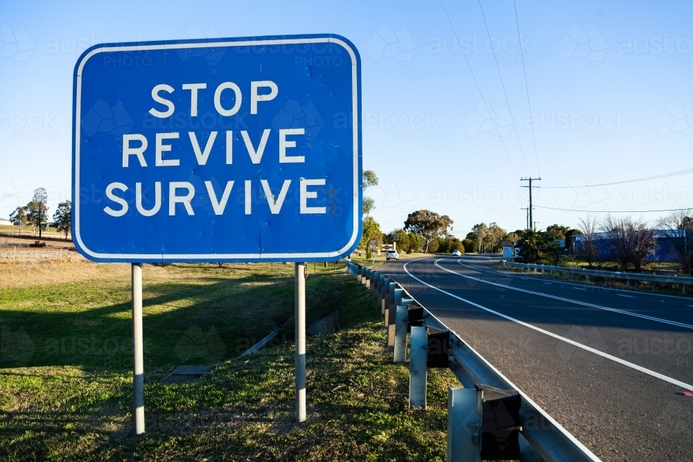 Stop revive survive sign beside highway - Australian Stock Image