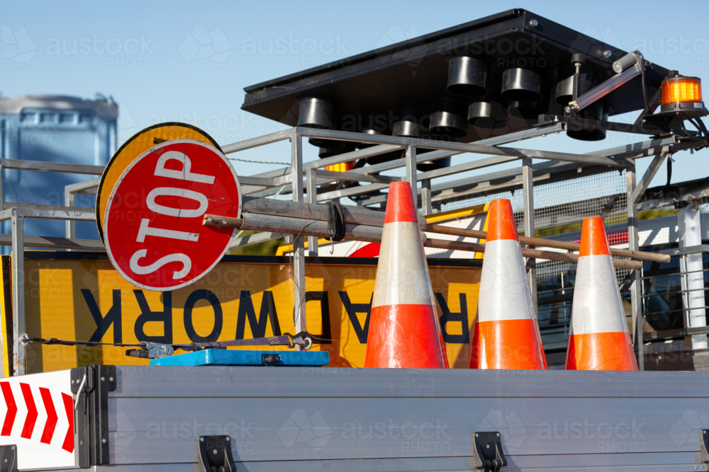 Stop sign and other signs and safety equipment for road maintenance on the back of a ute - Australian Stock Image
