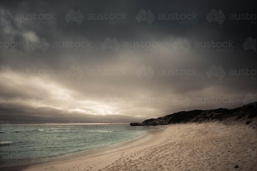 Storm clouds gathering over a pristine beach - Australian Stock Image