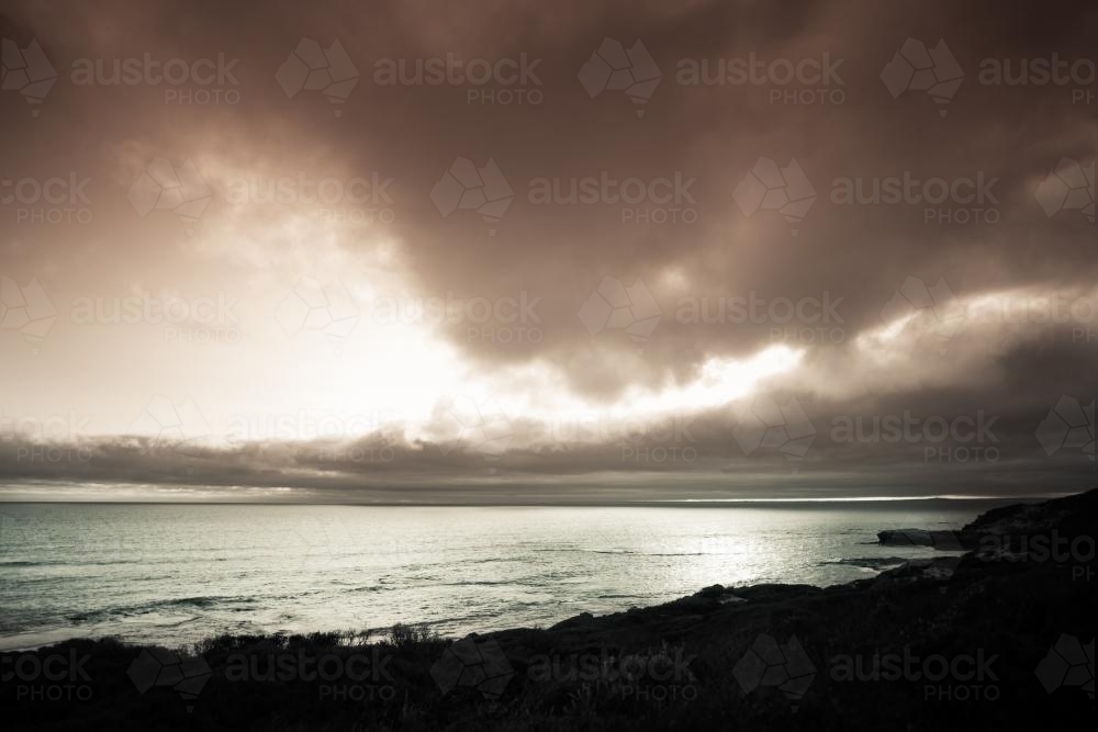 Storm clouds gathering over a pristine beach - Australian Stock Image