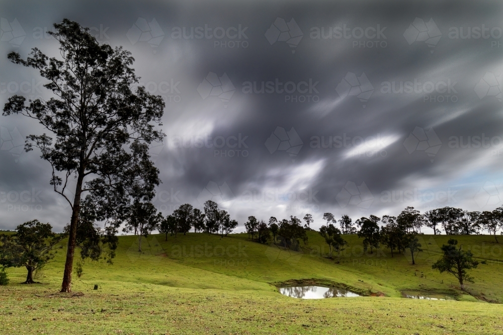 Storm clouds over farmland - Australian Stock Image