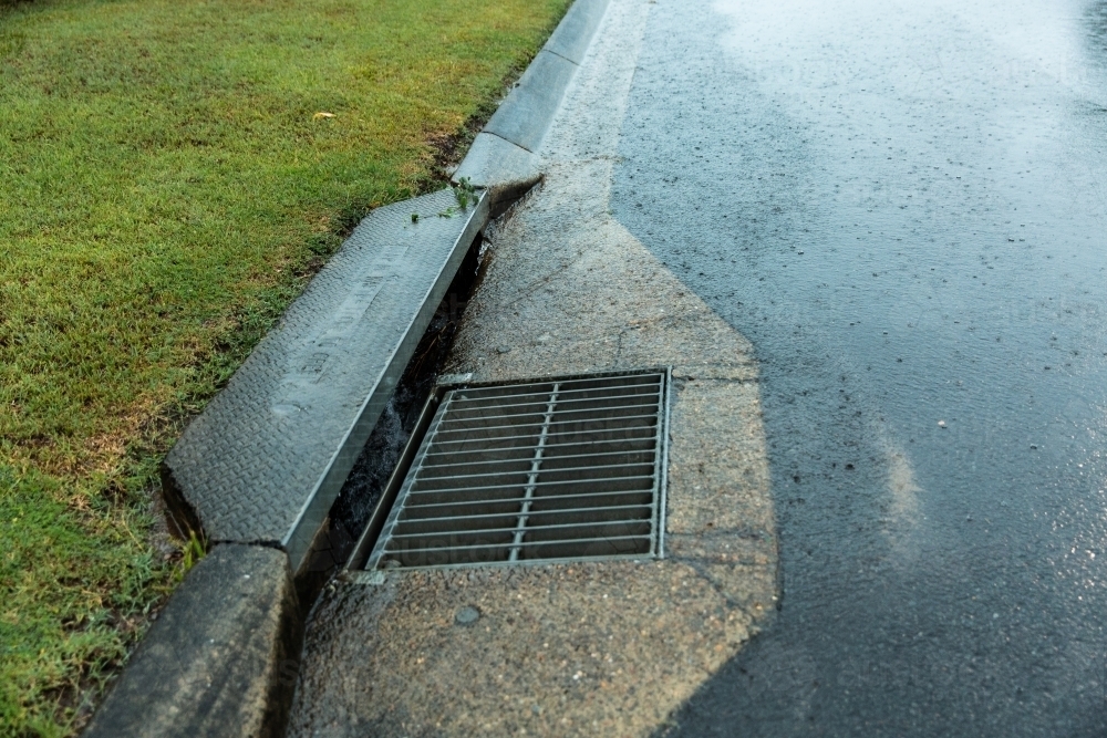 storm grate, drain and guttering - Australian Stock Image