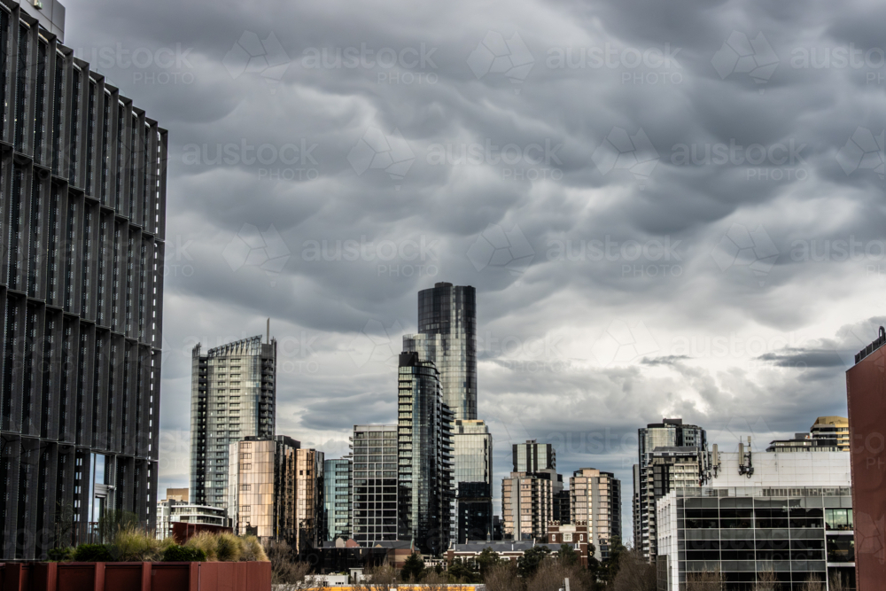 Storms over Melbourne CBD on a warm spring day in Melbourne - Australian Stock Image