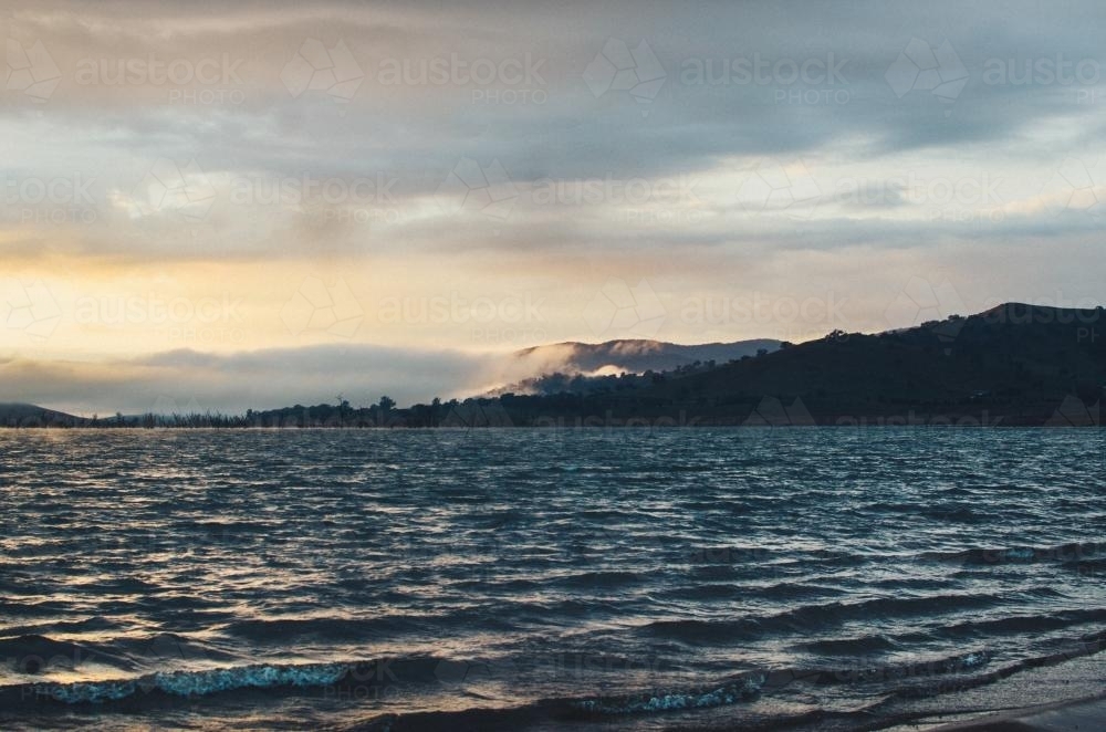 Stormy lake at sunrise - Australian Stock Image