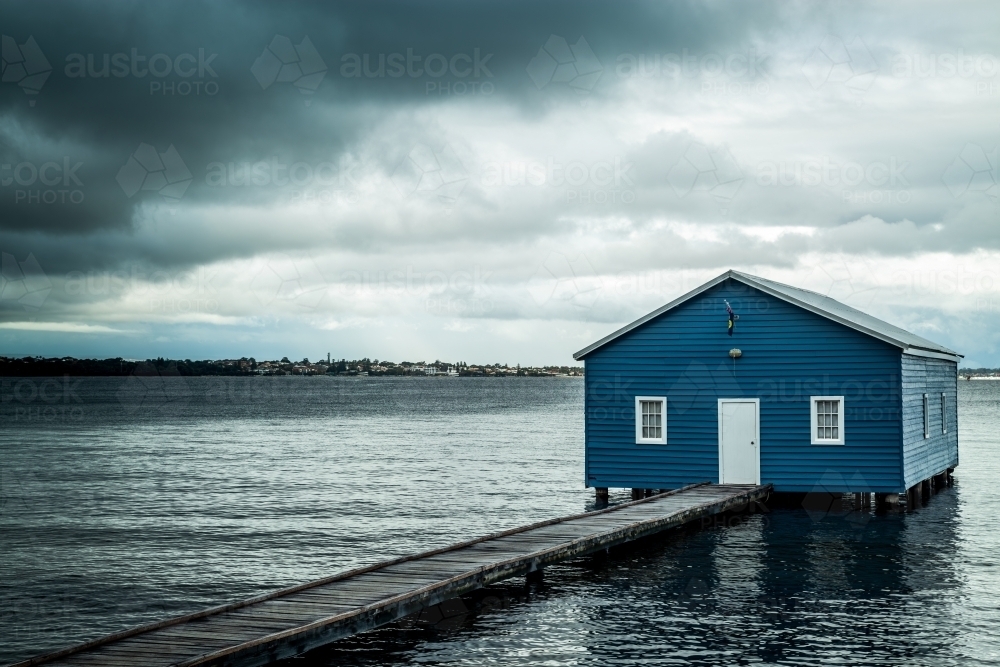 Stormy weather over Crawley Edge blue boatshed, Perth, Western Australia, Australia - Australian Stock Image