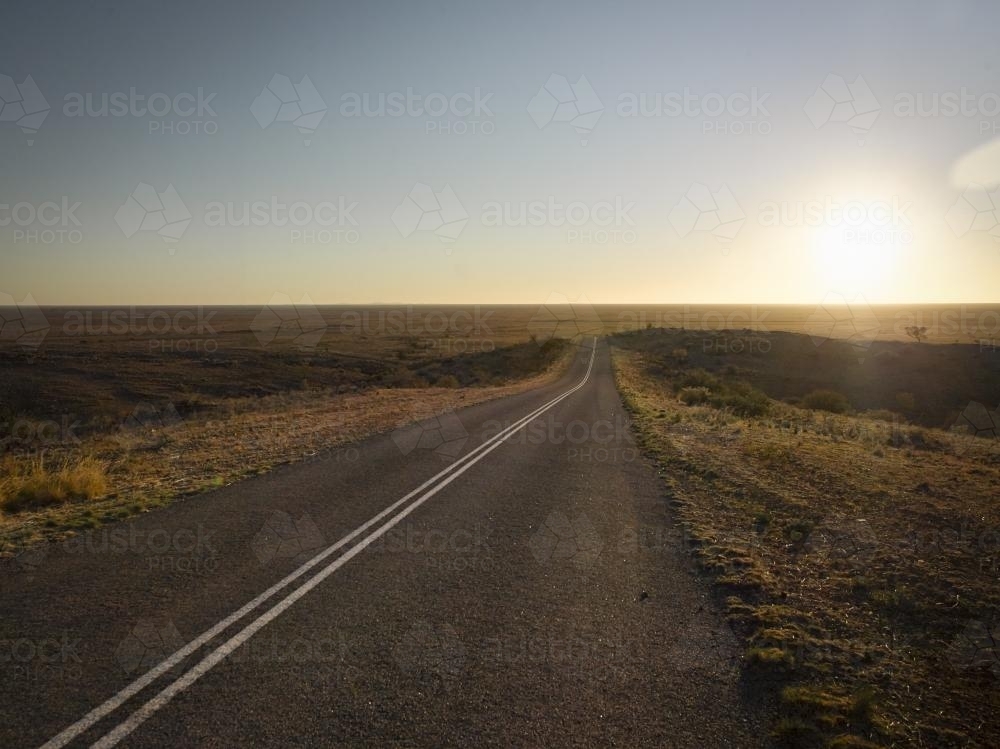 Straight road through open plain at Mundi Mundi Lookout - Australian Stock Image