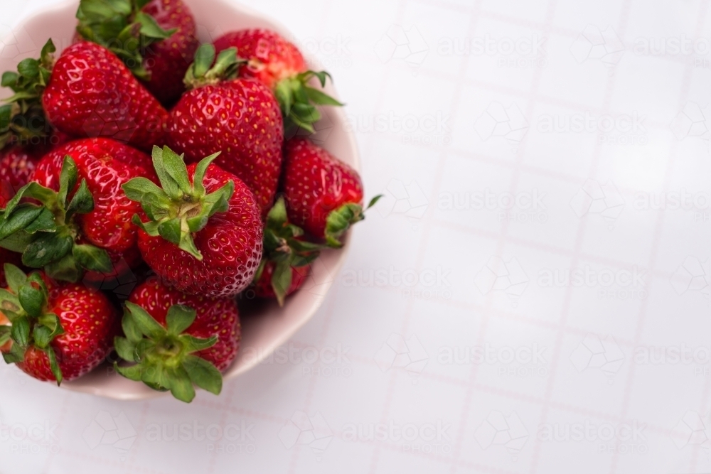strawberries in a bowl, with copyspace - Australian Stock Image
