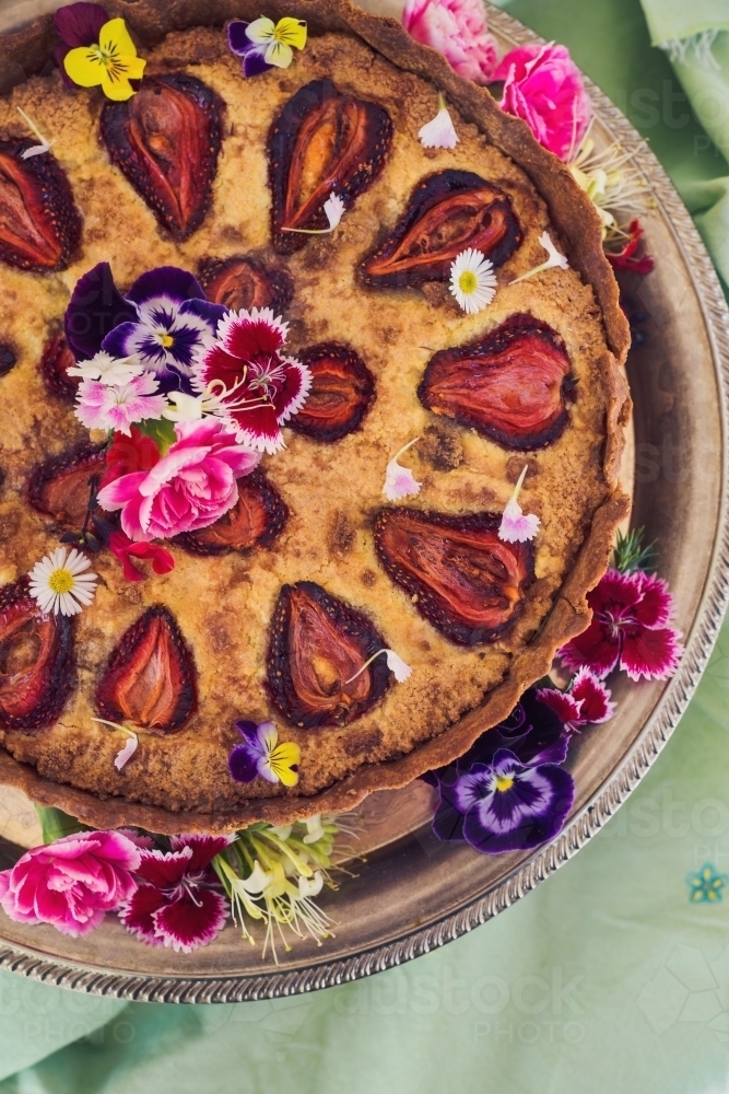 strawberry frangipane tart. with flowers - Australian Stock Image