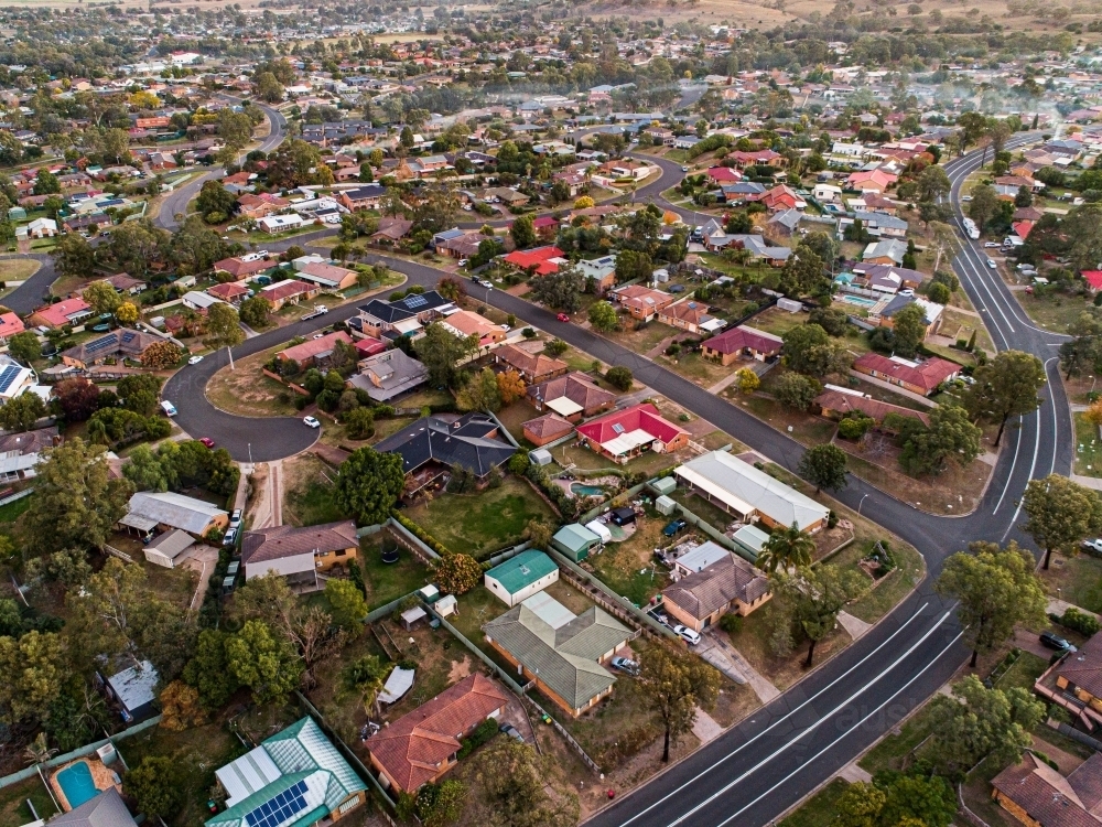 Streets and houses in Singleton Heights at dusk from drone - Australian Stock Image