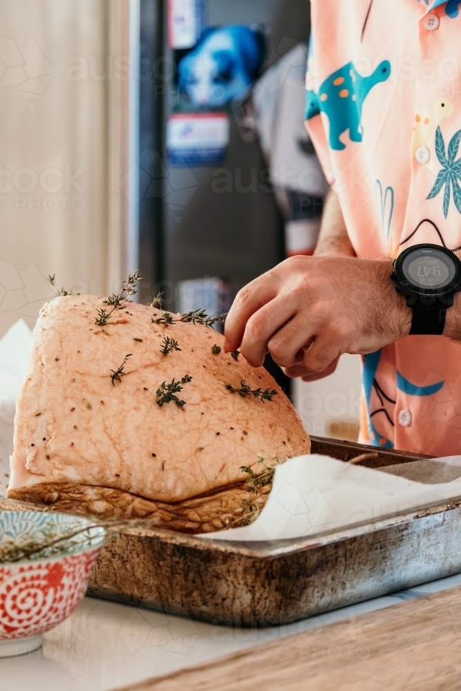 Studding ham with herbs. - Australian Stock Image