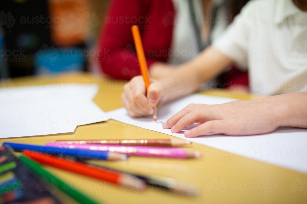 Image of Student Drawing with Coloured Pencils - Austockphoto