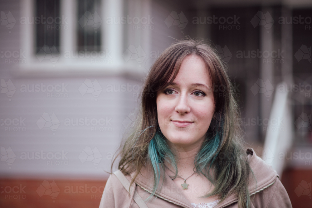 Student with Dyed Hair in Front of home - Australian Stock Image