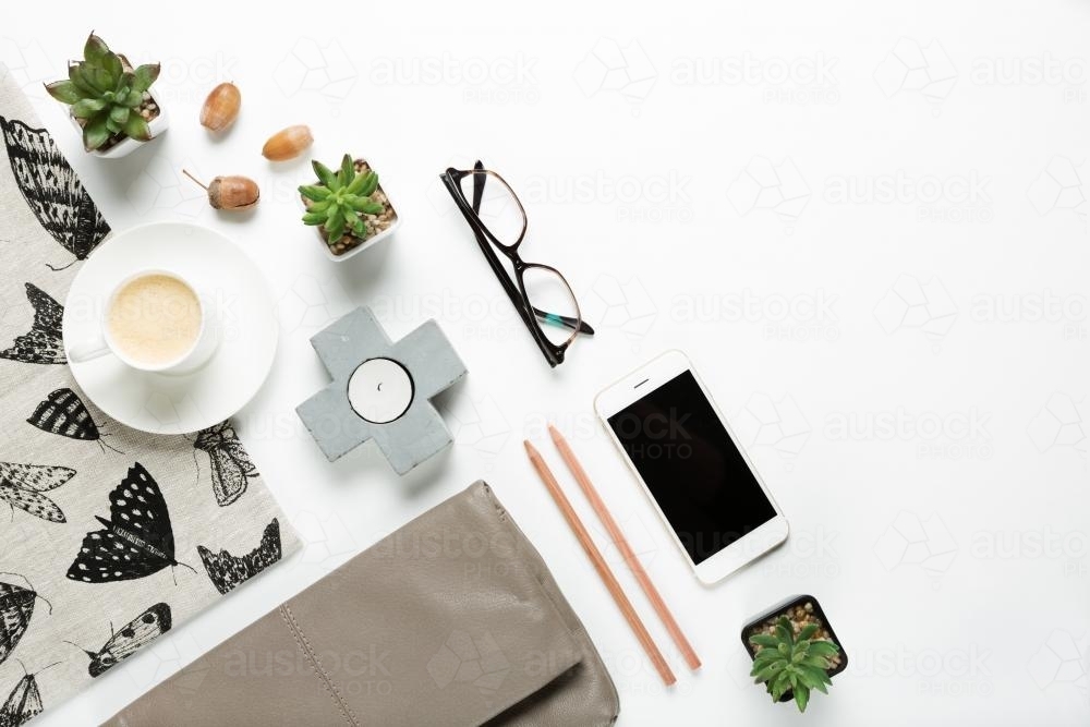 Styled collection of home objects and womens fashion accessories flat lay overhead - Australian Stock Image