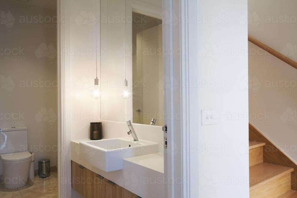 Stylish pendant light in powder room bathroom in luxury home - Australian Stock Image