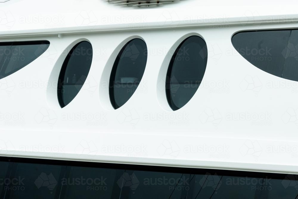 Stylized portholes on a boat. - Australian Stock Image