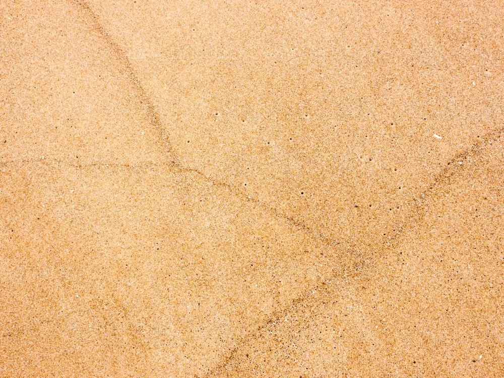 Subtle patterns in beach sand - Australian Stock Image